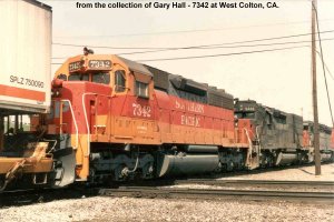 left hand side three quarter shot of #7342 in Daylight paint as last unit on a pig train at West Colton, CA. from the collection of Gary Hall